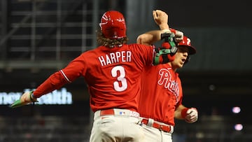 Oct 21, 2023; Phoenix, Arizona, USA; Philadelphia Phillies catcher J.T. Realmuto (10) reacts with Philadelphia Phillies designated hitter Bryce Harper (3) after hitting a two run home run against the Arizona Diamondbacks in the eighth inning during game five of the NLCS for the 2023 MLB playoffs at Chase Field. Mandatory Credit: Mark J. Rebilas-USA TODAY Sports