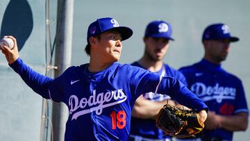 Feb 9, 2024; Glendale, AZ, USA; Los Angeles Dodgers pitcher Yoshinobu Yamamoto (18) throws from the practice mound as members of his team watch on at Camelback Ranch during Spring Training Workouts. Mandatory Credit: Allan Henry-USA TODAY Sports