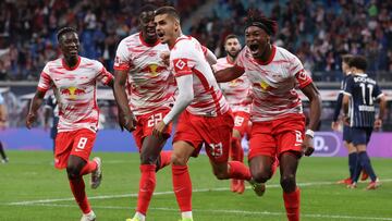 LEIPZIG, GERMANY - OCTOBER 02: André Silva of Leipzig celebrates scoring his team's first goal with Amadou Haidara, Nordi Mukiele and Mohamed Simakan during the Bundesliga match between RB Leipzig and VfL Bochum at Red Bull Arena on October 0