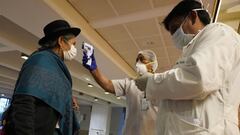 LA PAZ, BOLIVIA - APRIL 23: Senator Soria Chiri has her temperature taken before the regular session to address the issue of a law to combat the Coronavirus (COVID-19) epidemic during national lockdown at Central Bank on  April 23, 2020 in La Paz, Bolivia