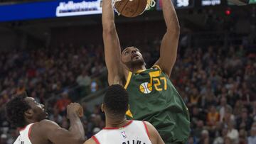 SALT LAKE CITY, UT - DECEMBER 25: Rudy Gobert #27 of the Utah Jazz dunks the ball over Al-Farouq Aminu #8 and CJ McCollum #3 of the Portland Trail Blazers during their game at the Vivint Smart Home Arena on December 25, 2018 in Salt Lake City , Utah. NOTE TO USER: User expressly acknowledges and agrees that, by downloading and or using this photograph, User is consenting to the terms and conditions of the Getty Images License Agreement.   Chris Gardner/Getty Images/AFP
 == FOR NEWSPAPERS, INTERNET, TELCOS &amp; TELEVISION USE ONLY ==
