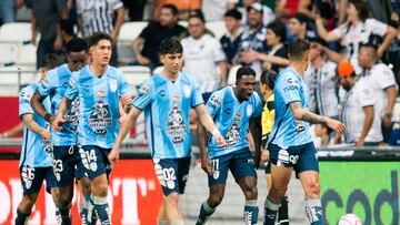 Pachuca's Aviles Hurtado (2-R) celebrates after scoring a penalty against Monterrey during their Mexican Apertura football tournament semifinal match at the BBVA Bancomer stadium, in Monterrey, Mexico, on October 23, 2022. (Photo by Julio Cesar AGUILAR / AFP)