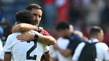 US' Serbian coach Marko Mitrovic (R) reacts with US' defender #02 Nathan Harriel ftaer losing the men's quarter-final football match between Morocco and the USA at the Paris 2024 Olympic Games at the Parc des Princes in Paris on August 2, 2024. (Photo by Paul ELLIS / AFP)