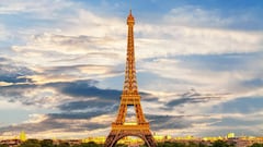 How much taller does the Eiffel Tower get in the summer and shrink in the winter?