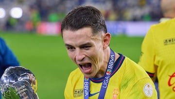 Alvaro Fidalgo of America celebrates victory with the champion trophy after the final second-leg match between Mon terrey and America as part of the Torneo Apertura 2024 Liga MX at BBVA Bancomer Stadium, on December 15, 2024 in Monterrey, Nuevo Leon, Mexico.