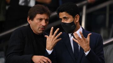 Paris Saint-Germain's Brazilian sporting director Leonardo (L) and Paris Saint-Germain's Qatari President Nasser Al-Khelaifi (R) speak during the French L1 football match between Paris Saint-Germain (PSG) and Montpellier (MHSC) at The Parc des Princes stadium in Paris on September 25, 2021. (Photo by FRANCK FIFE / AFP)