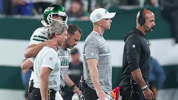 Sep 11, 2023; East Rutherford, New Jersey, USA; Medical staff help New York Jets quarterback Aaron Rodgers (8) off the field head behind coach Robert Saleh during the first half against the Buffalo Bills at MetLife Stadium. Mandatory Credit: Vincent Carchietta-USA TODAY Sports