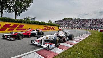 Timo Glock (24) of from Marussia Virgin Racing and Kamui Kobayashi (16) from Sauber Team F1 in the Senna curve, at the Circuit Gilles Villeneuve in Montreal on June 11, 2011 during the third practice session for the Canadian Formula One Grand Prix. AFP PHOTO / ROGERIO BARBOSA