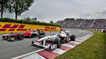 Timo Glock (24) of Germany from Marussia Virgin Racing and Kamui Kobayashi (16) from Sauber Team F1 in the Senna curve, at the Circuit Gilles Villeneuve in Montreal on June 11, 2011 during the third practice session for the Canadian Formula One Grand Prix. AFP PHOTO / ROGERIO BARBOSA