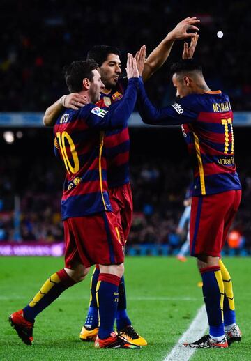 Neymar celebrates with his teammates Lionel Messi and Luis Suarez of FC Barcelona after scoring his team's sixth goal against Celta.