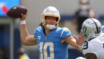 INGLEWOOD, CALIFORNIA - SEPTEMBER 11: Quarterback Justin Herbert #10 of the Los Angeles Chargers attempts a pas during the first half against the Las Vegas Raiders at SoFi Stadium on September 11, 2022 in Inglewood, California.   Harry How/Getty Images/AFP