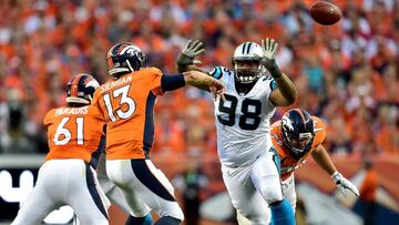 DENVER, CO - SEPTEMBER 08: Quarterback Trevor Siemian #13 of the Denver Broncos throws the ball against defensive tackle Star Lotulelei #98 of the Carolina Panthers in the first half at Sports Authority Field at Mile High on September 8, 2016 in Denver, Colorado.   Dustin Bradford/Getty Images/AFP
 == FOR NEWSPAPERS, INTERNET, TELCOS &amp; TELEVISION USE ONLY ==