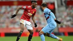 MANCHESTER, ENGLAND - MARCH 14: Aaron Wan-Bissaka of Manchester United on the ball during the Premier League match between Manchester United and West Ham United at Old Trafford on March 14, 2021 in Manchester, England. Sporting stadiums around the UK rema