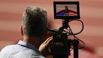 DOHA, QATAR - OCTOBER 04: Dalilah Muhammad of the United States is filmed by a TV camera after winning gold in the Women's 400 metres hurdles final during day eight of 17th IAAF World Athletics Championships Doha 2019 at Khalifa International Stadium