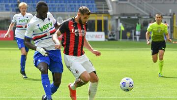 AC Milan's French defender Theo Hernandez (C) works around Sampdoria's Gambian defender Omar Colley during the Italian Serie A football match AC Milan vs Sampdoria on April 03, 2021 at the San Siro stadium in Milan. (Photo by Tiziana FABI / AFP)