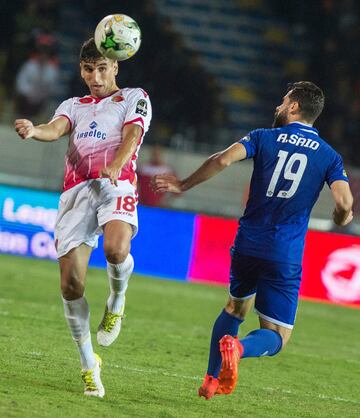 Wydad Casablanca's Walid al-Karti (L) vies for the ball against Al-Ahly's Abdallah Said during the CAF Champions League final football match between Egypt's Al-Ahly and Morocco's Wydad Casablanca on November 4, 2017, at Mohamed V Stadium in Casablanca.