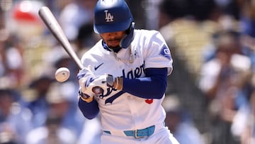 LOS ANGELES, CALIFORNIA - JUNE 16: Mookie Betts #50 of the Los Angeles Dodgers gets hit by a pitch during the seventh inning against the Kansas City Royals at Dodger Stadium on June 16, 2024 in Los Angeles, California.   Katelyn Mulcahy/Getty Images/AFP (Photo by Katelyn Mulcahy / GETTY IMAGES NORTH AMERICA / Getty Images via AFP)