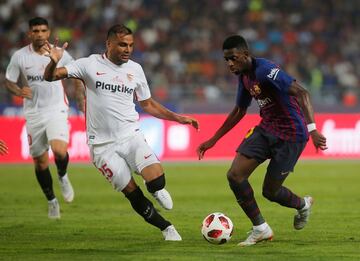 Soccer Football - Spanish Super Cup - Barcelona v Sevilla - Grand Stade de Tanger, Tangier, Morocco - August 12, 2018   Barcelona's Ousmane Dembele in action with Sevilla's Gabriel Mercado   REUTERS/Jon Nazca