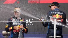 Formula One F1 - Japanese Grand Prix - Suzuka Circuit, Suzuka, Japan - April 7, 2024 Red Bull's Max Verstappen celebrates with sparkling wine on the podium after winning the Japanese Grand Prix with second placed Red Bull's Sergio Perez REUTERS/Kim Kyung-Hoon