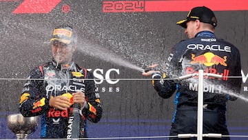 Formula One F1 - Japanese Grand Prix - Suzuka Circuit, Suzuka, Japan - April 7, 2024 Red Bull's Max Verstappen celebrates with sparkling wine on the podium after winning the Japanese Grand Prix with second placed Red Bull's Sergio Perez REUTERS/Kim Kyung-Hoon