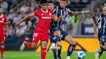 Monterrey's Brandon Vazquez (L) and Toluca's Jesus Gallardo fight for the ball during the Liga MX Apertura tournament football match between Monterrey and Toluca at the BBVA Stadium in Monterrey, Nuevo Leon State, Mexico, on August 31, 2024. (Photo by Julio Cesar AGUILAR / AFP)