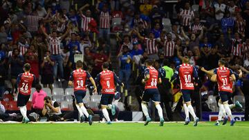 Guadalajara�s player Yonathan Calderon celebrates his goal against Cruz Azul with his teammates during their Mexican Clausura 2022 football tournament match at the Azteca stadium in Mexico City, on April 16, 2022. (Photo by ALFREDO ESTRELLA / AFP)