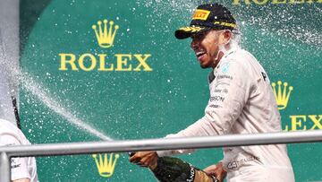 Lewis Hamilton celebrates his win on the podium in Hockenheim.