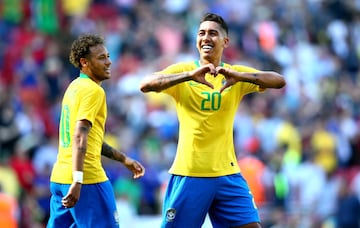 Roberto Firmino celebrates his stoppage time goal for Brazil against Croatia at Anfield.