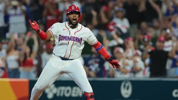 Mar 8, 2026; Miami, FL, United States; Dominican Republic first baseman Vladimir Guerrero Jr. (27) celebrates from first base after hitting an RBI single against the Netherlands during the first inning at loanDepot Park. Mandatory Credit: Sam Navarro-Imagn Images