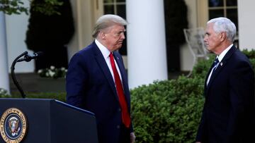 FILE PHOTO: U.S. President Donald Trump turns to Vice President Mike Pence as they depart following a coronavirus response news conference in the Rose Garden at the White House in Washington, U.S., April 27, 2020. REUTERS/Carlos Barria/File Photo