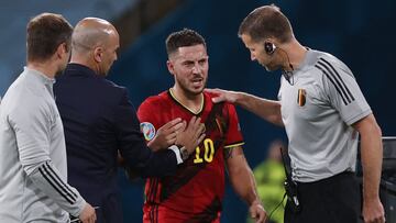 Belgium's midfielder Eden Hazard is substituted by Belgium's Spanish coach Roberto Martinez (2L) during the UEFA EURO 2020 round of 16 football match between Belgium and Portugal at La Cartuja Stadium in Seville on June 27, 2021. (Photo by Julio