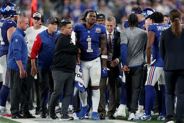 Malik Nabers (1) is helped off the field after the injury.