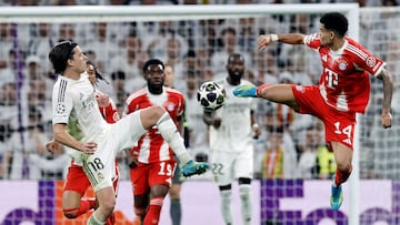 Real Madrid's Spanish defender #18 Alvaro Carreras and Bayern Munich's Colombian forward #14 Luis Diaz fight for the ball during the UEFA Champions League quarter final first leg football match between Real Madrid CF and FC Bayern Munich at Santiago Bernabeu Stadium in Madrid on April 7, 2026. (Photo by Oscar DEL POZO / AFP)