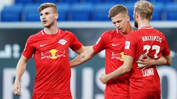 Leipzig's Spanish midfielder Dani Olmo (C) celebrates scoring the opening goal with Leipzig's German forward Timo Werner (L0 and Leipzig's Austrian midfielder Konrad Laimer during the German first division Bundesliga football match TSG 1899