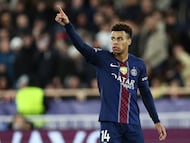 TOPSHOT - Paris Saint-Germain's French midfielder #14 Desire Doue celebrates scoring his team's third goal during the UEFA Champions League knockout round play-off first leg football match between AS Monaco and Paris Saint-Germain at the Stade Louis II in the Principality of Monaco on February 17, 2026. (Photo by Valery HACHE / AFP)