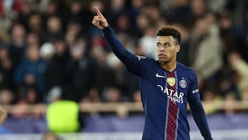 TOPSHOT - Paris Saint-Germain's French midfielder #14 Desire Doue celebrates scoring his team's third goal during the UEFA Champions League knockout round play-off first leg football match between AS Monaco and Paris Saint-Germain at the Stade Louis II in the Principality of Monaco on February 17, 2026. (Photo by Valery HACHE / AFP)