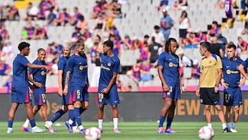 Barcelona FC team players warm up before the Spanish league football match between FC Barcelona and Real Valladolid FC at the Estadi Olimpic Lluis Companys in Barcelona on August 31, 2024. (Photo by MANU QUINTERO / AFP)