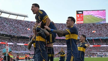 Boca Juniors' midfielder #05 Leandro Paredes (L) celebrates with teammates after scoring the opening goal during the Argentine Professional Football League 2026 Apertura Tournament match between River Plate and Boca Juniors at MAS Monumental stadium in Buenos Aires on April 19, 2026. (Photo by JUAN MABROMATA / AFP)