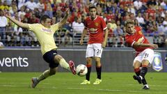Club America&#039;s Pablo Cesar Aguilar, left, blocks a shot on goal by Manchester United&#039;s Adnan Januzaj, right, during the second half of an international friendly soccer match, Friday, July 17, 2015, in Seattle. (AP Photo/Ted S. Warren)