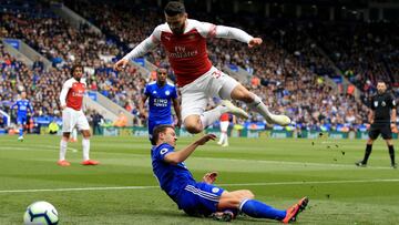 LEICESTER, ENGLAND - APRIL 28: Sead Kolasinac of Arsenal in action with Jonny Evans of Leicester City during the Premier League match between Leicester City and Arsenal FC at The King Power Stadium on April 28, 2019 in Leicester, United Kingdom.  (Photo b