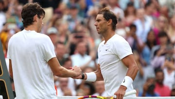 LONDON, ENGLAND - JULY 06: Rafael Nadal of Spain shakes hands with Taylor Fritz of The United States following their victory in the Men's Singles Quarter Final match on day ten of The Championships Wimbledon 2022 at All England Lawn Tennis and Croquet Club on July 06, 2022 in London, England. (Photo by Clive Brunskill/Getty Images)