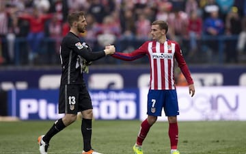 Antoine Griezmann (R) of Atletico de Madrid clashes hands with goalkeeper Jan Oblak (L) after the La Liga match between Club Atletico de Madrid and Real Betis Balompie at Vicente Calderon Stadium on April 2, 2016 in Madrid, Spain. (Photo by Gonzalo Arroyo