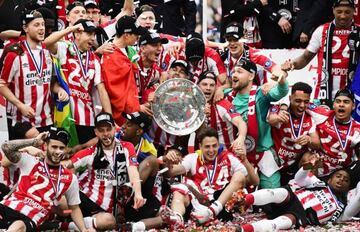 PSV players celebrate winning the Dutch Eredivisie championship after the match against Ajax in the PSV stadium in Eindhoven