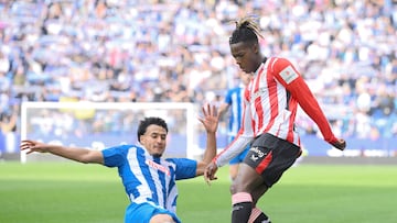 Athletic Bilbao's Spanish forward #10 Nico Williams fights for the ball with Espanyol's Spanish-Moroccan defender #23 Omar El Hilali during the Spanish league football match between RCD Espanyol and Athletic Club Bilbao at�the RCDE Stadium in Cornella de Llobregat on February 16, 2025. (Photo by Josep LAGO / AFP)
