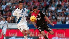 Monterrey's Argentine midfielder Maximiliano Meza (L) and Atlas' defender Gaddi Aguirre fight for the ball during the Mexican Clausura tournament football match between Atlas and Monterrey at the Jalisco Stadium in Guadalajara, Jalisco State, Mexico, on March 17, 2024. (Photo by ULISES RUIZ / AFP)