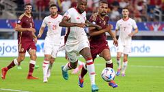Canada's forward #09 Cyle Larin (C) fights for the ball with Venezuela's midfielder #06 Yangel Herrera (2nd R) during the Conmebol 2024 Copa America tournament quarter-final football match between Venezuela and Canada at AT&T Stadium in Arlington, Texas, on July 5, 2024. (Photo by CHARLY TRIBALLEAU / AFP)