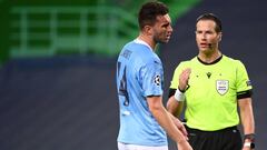 Dutch referee Danny Makkelie talks to Manchester City&#039;s French defender Aymeric Laporte during the UEFA Champions League quarter-final football match between Manchester City and Lyon at the Jose Alvalade stadium in Lisbon on August 15, 2020. (Photo b