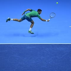 Serbia's Novak Djokovic returns to Denmark's Holger Rune during their first round-robin match at the ATP Finals tennis tournament in Turin on November 12, 2023. (Photo by Tiziana FABI / AFP)