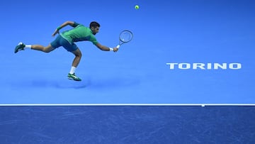 Serbia's Novak Djokovic returns to Denmark's Holger Rune during their first round-robin match at the ATP Finals tennis tournament in Turin on November 12, 2023. (Photo by Tiziana FABI / AFP)