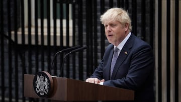 Prime Minister Boris Johnson, watched by wife Carrie Johnson (centre holding daughter Romy), reads a statement outside 10 Downing Street, London, formally resigning as Conservative Party leader after ministers and MPs made clear his position was untenable. He will remain as Prime Minister until a successor is in place. Picture date: Thursday July 7, 2022. (Photo by Gareth Fuller/PA Images via Getty Images)